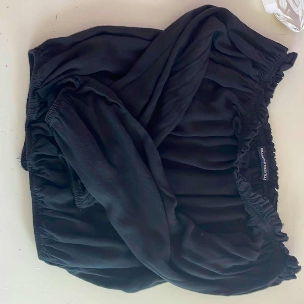 A brandy Melville off the shoulder black top fits a small and xs